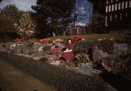 Antoinette Bentley seated in garden at 1402 McRae Avenue