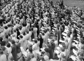 [Choir performing for King George VI and Queen Elizabeth outside City Hall]