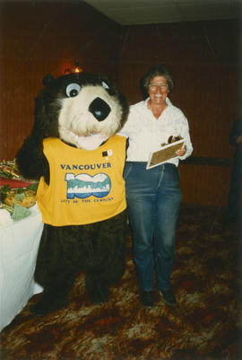 Tillicum with woman in front of buffet table