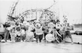 Group of mascots in front of roller coaster at PNE grounds