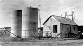 Storage tanks and shed at rail line