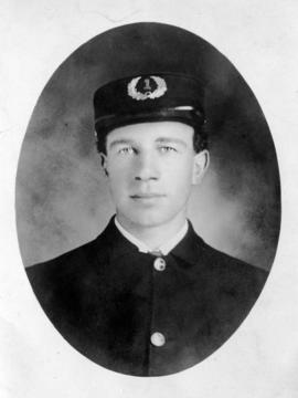 [Studio portrait of firefighter Alex Alexander]