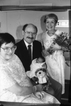Mike Harcourt and [Leora Apsouris] visiting with the Vancouver Centennial baby [Cheryl Lynn Allan...