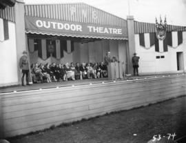 A.E. (Dal) Grauer, president of B.C. Electric Co., giving speech on Outdoor Theatre stage at 1953...