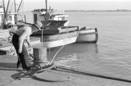 [A man on dock near the "Seiner" and "Jennie Bay"]