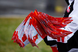 Day 30 New Brunswick Coke flags being handed out by a Coke volunteer.