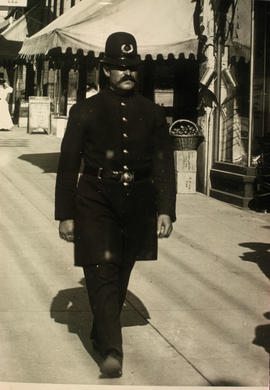 Police officer on Granville Street at Robson Street