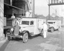 Port O'Van [Ice Cream Limited - "Arctic" Ice Cream] trucks [being loaded]