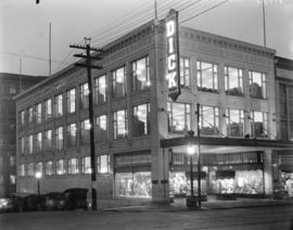 [William Dick clothing store at the corer of Hastings and Homer Streets, lit with electric lights]