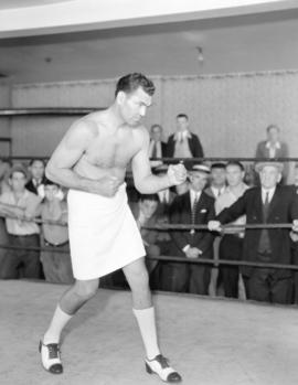 Jack Dempsey [posing in the ring]