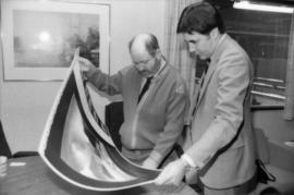 Toni Onley and Robert Dubberley examine Centennial Art Series print at Agency Press