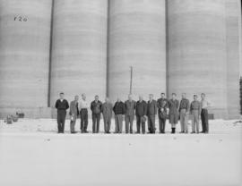 Management, supervisors and office staff pictured in front of bins