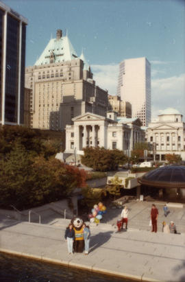 View from above of Tillicum holding balloons in downtown Vancouver