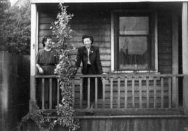 Lillian Ho Wong and Winnifred Eng at the alley entrance to 350 East Pender Street