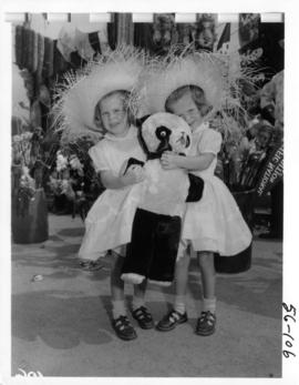 Young girls with stuffed animal in P.N.E. Gayway