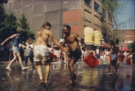 "Giant Fire Drill" participants carry buckets of water