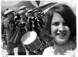 Piper hostess Sandra MacDonald, for B.C. Pavilion at Osaka receiving a musical send-off by member...