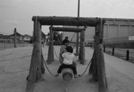 People on playground at Mid-Summer Festival at Strathcona Community Centre