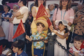 Children waving red flags