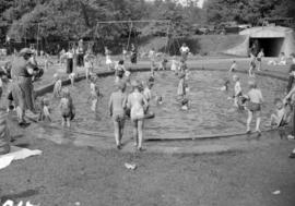 [Children playing at the Second Beach playground pool]