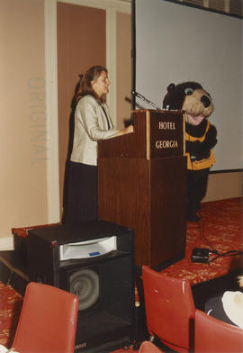 Unidentified woman and Tillicum at Wake Up Awards ceremony