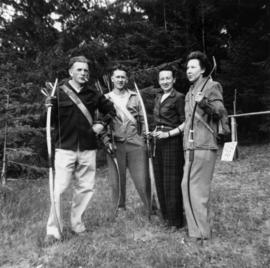 Group photograph of four Greenwood Archers members [in Stanley Park]