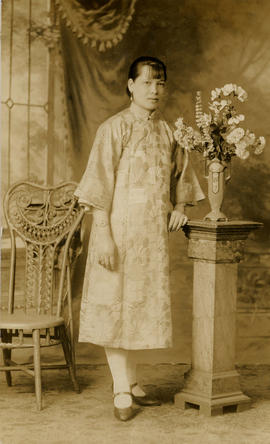 Unidentified Chinese woman w wicker chair - 1920s