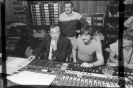 Group behind mixing boards at Griffiths Gibson Productions