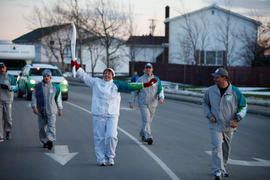 Day 16 Torchbearer 60 Sandy Chiasson  walks the flame through Gander, Newfoundland Labrador.