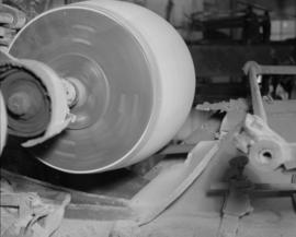 Machine sanding a barrel