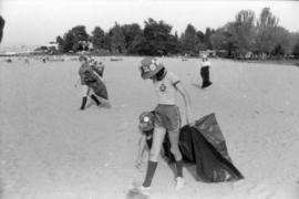 Girl Guides picking up litter from beach